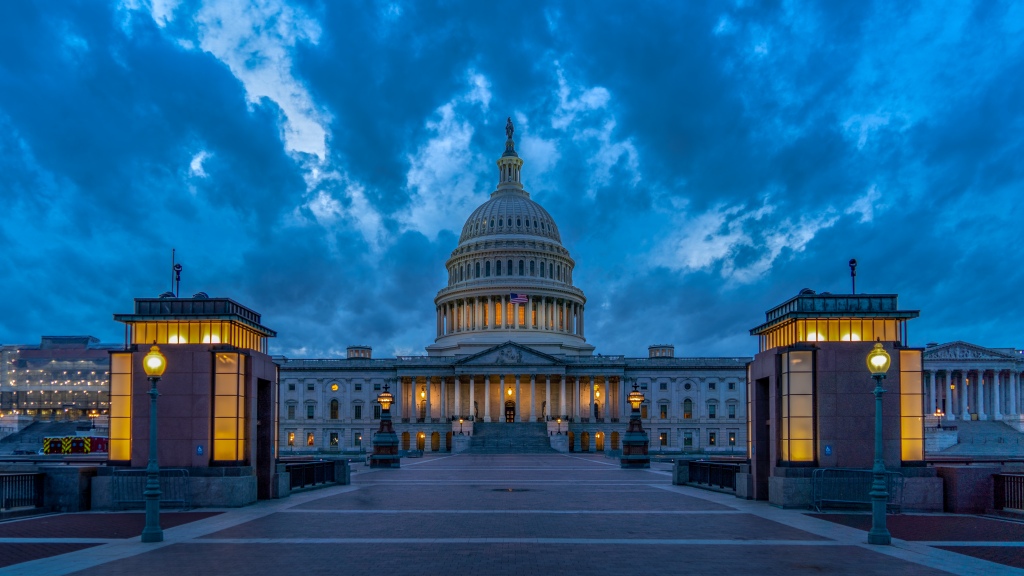 Photo is of the US Capitol in the evening.